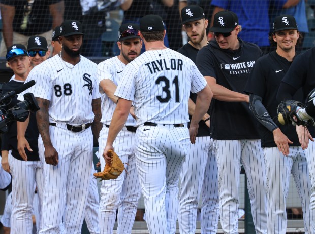 White Sox players congratulate pitcher Grant Taylor after a 1-0 win over the Giants on Saturday, June 28, 2025, at Rate Field. (John J. Kim/Chicago Tribune)