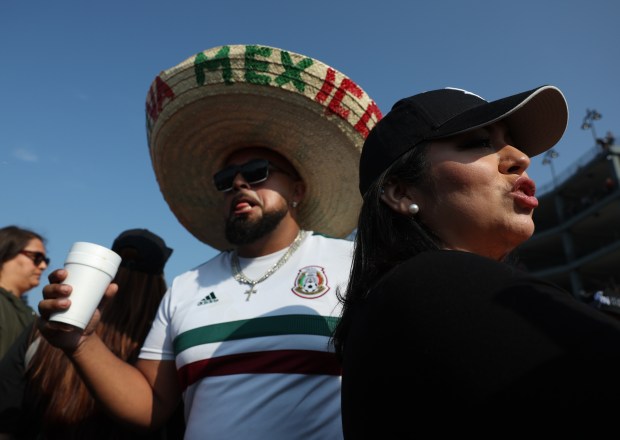 People mingle in a parking lot before a White Sox-Royals game on Mexican Heritage Night at Rate Field on June 6, 2025, in Chicago. (John J. Kim/Chicago Tribune)