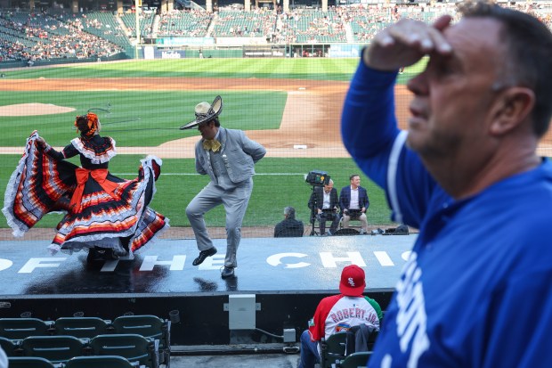 A Royals fan looks for his friends as members of...