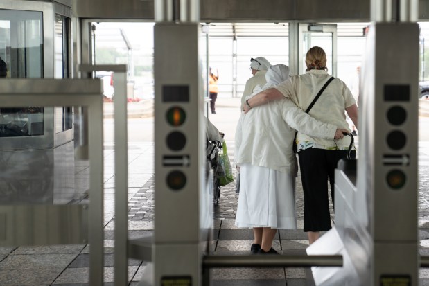 Members of Little Sisters of the Poor exit the Red Line before making their way to Rate Field on June 14, 2025. (Audrey Richardson/Chicago Tribune)