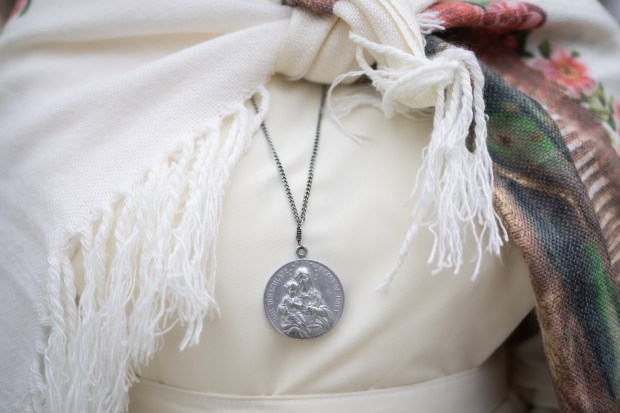Sister Max Nanyanzi, of Immaculate Heart of Mary Reparatrix, waits in line to enter Rate Field before celebrating the election of Pope Leo XIV with a citywide gathering and Catholic Mass on June 14, 2025. (Audrey Richardson/Chicago Tribune)