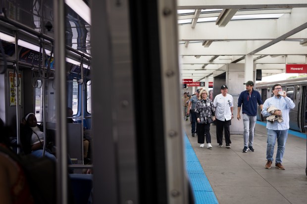 People exit the Red Line before making their way to Rate Field as Chicago celebrates the election of Pope Leo XIV with a citywide gathering and Catholic Mass on June 14, 2025. (Audrey Richardson/Chicago Tribune)