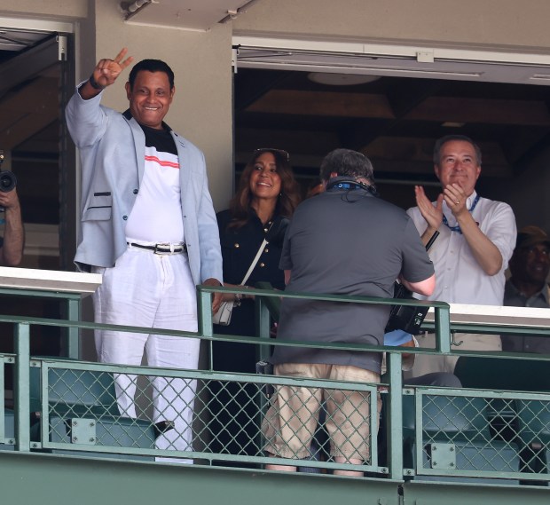 Former Chicago Cubs player Sammy Sosa acknowledges the applause from...