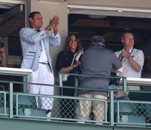 Former Chicago Cubs player Sammy Sosa acknowledges the applause from...