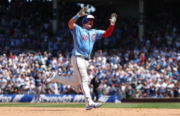 Cubs catcher Reese McGuire celebrates as he rounds the bases after hitting a solo home run in the fifth inning against the Mariners on Friday, June 20, 2025, at Wrigley Field. (Chris Sweda/Chicago Tribune)