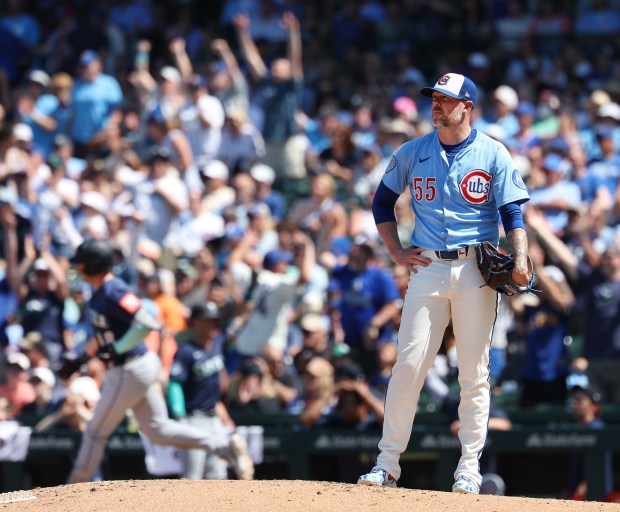 Cubs reliever Ryan Pressly stands on the mound as Mariners designated hitter Mitch Garver rounds the bases after hitting a two-run home run in the sixth inning on Friday, June 20, 2025, at Wrigley Field. (Chris Sweda/Chicago Tribune)