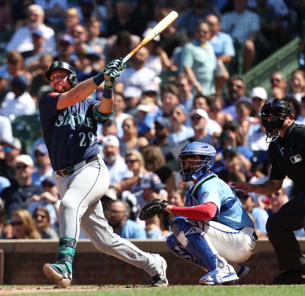 Mariners catcher Cal Raleigh hits a two-run home run in the seventh inning against the Cubs on Friday, June 20, 2025, at Wrigley Field. (Chris Sweda/Chicago Tribune)