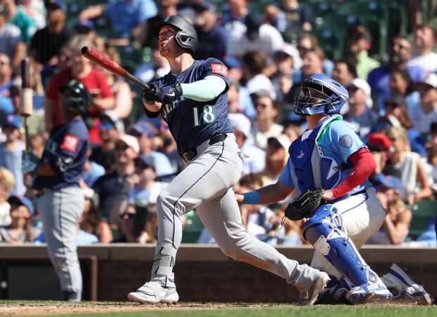 Mariners designated hitter Mitch Garver watches the flight of his three-run home run in the ninth inning against the Cubs on Friday, June 20, 2025, at Wrigley Field. (Chris Sweda/Chicago Tribune)