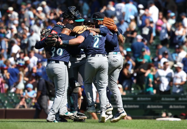 The Mariners celebrate after a 9-4 victory over the Cubs on Friday, June 20, 2025, at Wrigley Field. (Chris Sweda/Chicago Tribune)