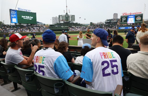 Fans wear Pride Chicago Cubs jerseys given out by the team ahead of a game against the Pirates on June 12, 2025,at Wrigley Field. (Chris Sweda/Chicago Tribune)