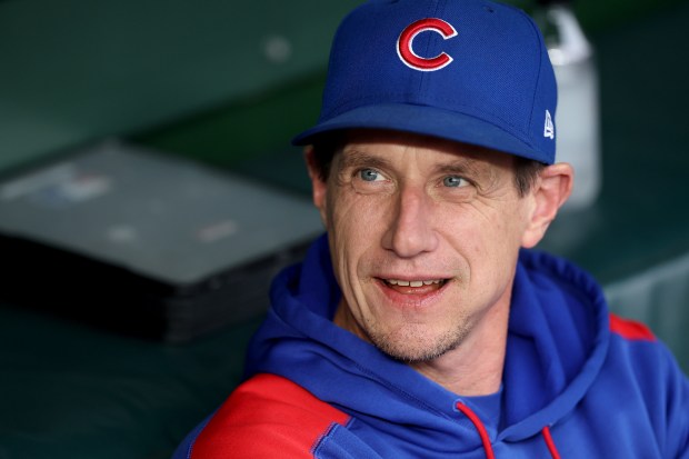 Cubs manager Craig Counsell has a laugh in the dugout before a game against the Pirates on June 12, 2025, at Wrigley Field. (Chris Sweda/Chicago Tribune)