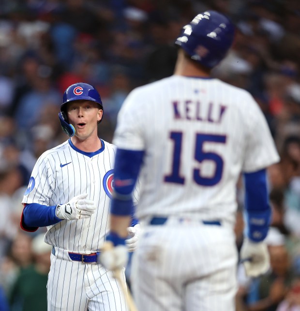 Cubs center fielder Pete Crow-Armstrong, left, celebrates with Carson Kelly after hitting a two-run home run in the fourth inning against the Pirates on June 12, 2025, at Wrigley Field. (Chris Sweda/Chicago Tribune)
