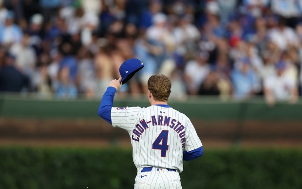 Cubs center fielder Pete Crow-Armstrong tips his cap to fans in the bleachers as he goes out to his position to start the fifth inning against the Pirates on June 12, 2025, at Wrigley Field. Crow-Armstrong hit a two-run home run in the bottom of the fourth. (Chris Sweda/Chicago Tribune)