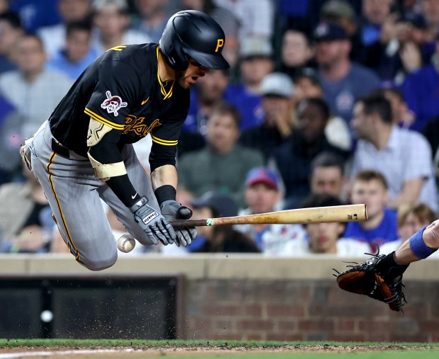 Pirates catcher Brett Sullivan is hit by a pitch in the seventh inning against the Cubs on June 12, 2025, at Wrigley Field. (Chris Sweda/Chicago Tribune)