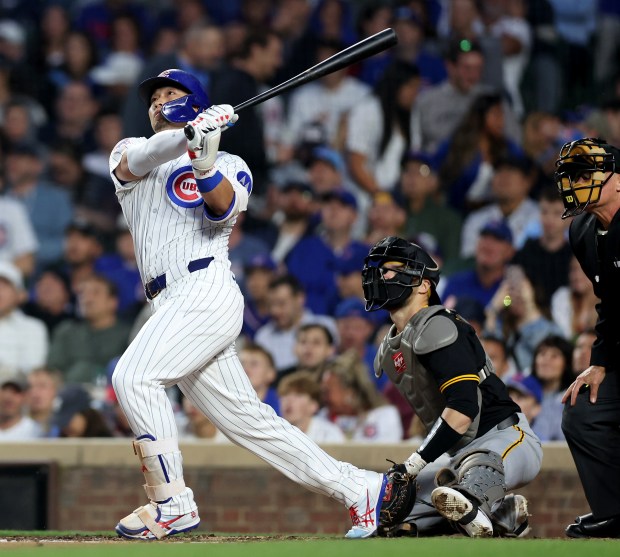 Cubs designated hitter Seiya Suzuki hits a solo home run in the sixth inning against the Pirates on June 12, 2025, at Wrigley Field. (Chris Sweda/Chicago Tribune)