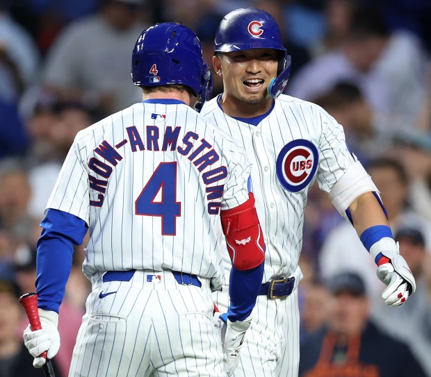 Cubs designated hitter Seiya Suzuki, right, celebrates with Pete Crow-Armstrong after hitting a solo home run in the sixth inning against the Pirates on June 12, 2025, at Wrigley Field. (Chris Sweda/Chicago Tribune)