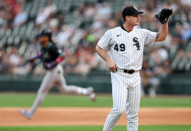 Chicago White Sox starting pitcher Jordan Leasure (49) stands on the mound as Arizona Diamondbacks second baseman Ketel Marte (left) rounds the bases after hitting a solo home run in the first inning of a game at Rate Field in Chicago on June 24, 2025. (Chris Sweda/Chicago Tribune)