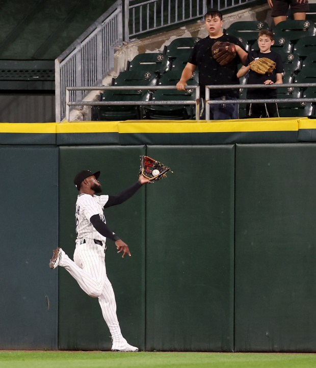 Chicago White Sox center fielder Luis Robert Jr. tracks down a long fly ball that went for a sacrifice fly for the Arizona Diamondbacks in the seventh inning of a game at Rate Field in Chicago on June 24, 2025. (Chris Sweda/Chicago Tribune)