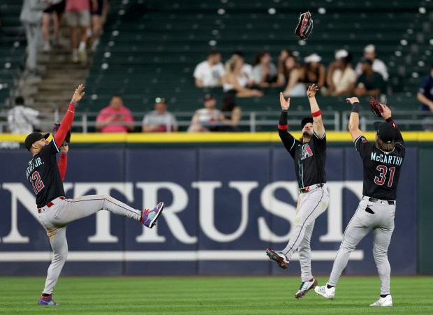 Arizona Diamondbacks outfielders L to R: Lourdes Gurriel Jr., Alek Thomas, and Jake McCarthy, celebrate after a victory over the Chicago White Sox at Rate Field in Chicago on June 24, 2025. (Chris Sweda/Chicago Tribune)