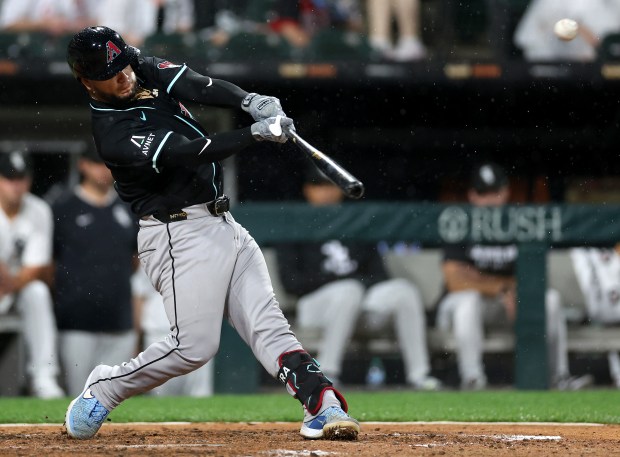 Arizona Diamondbacks catcher Jose Herrera (11) drives in a run on a sacrifice fly in the seventh inning of a game against the Chicago White Sox at Rate Field in Chicago on June 24, 2025. (Chris Sweda/Chicago Tribune)