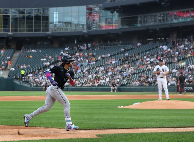 Arizona Diamondbacks second baseman Ketel Marte rounds the bases after hitting a solo home run off of Chicago White Sox starting pitcher Jordan Leasure (right) in the first inning of a game at Rate Field in Chicago on June 24, 2025. (Chris Sweda/Chicago Tribune)