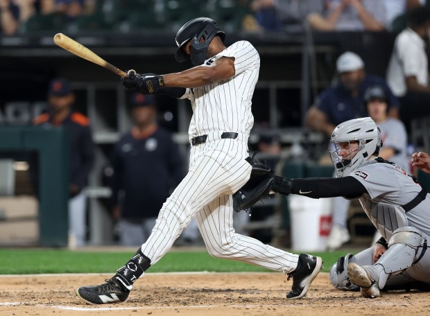 Chicago White Sox center fielder Michael A. Taylor hits a three-run home run in the sixth inning of a game against the Detroit Tigers at Rate Field in Chicago on June 3, 2025. (Chris Sweda/Chicago Tribune)