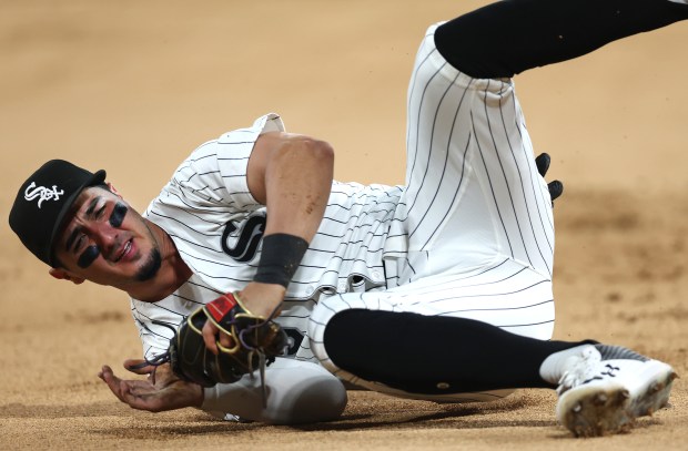 Chicago White Sox third baseman Josh Rojas falls to the ground while trying to field a ball that went for a run-scoring double for Detroit Tigers catcher Dillon Dingler in the seventh inning of a game at Rate Field in Chicago on June 3, 2025. (Chris Sweda/Chicago Tribune)