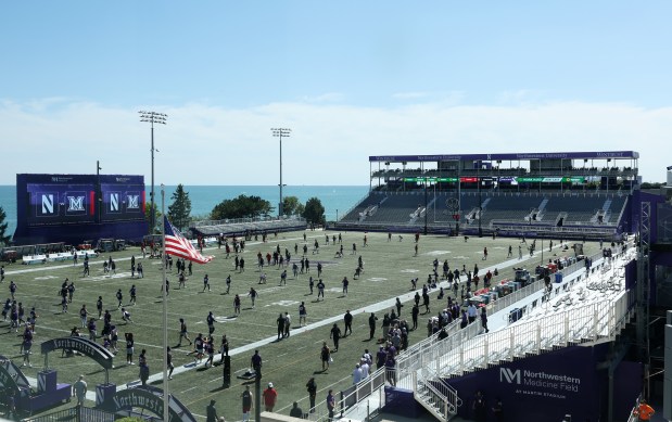 Northwestern football players warm up before a game against Miami (Ohio) at Martin Stadium on Aug. 31, 2024, in Evanston. (John J. Kim/Chicago Tribune)