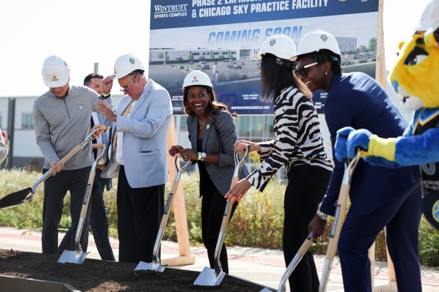 Sky co-owner and operating Chairman Nadia Rawlinson laughs as she stands with player Elizabeth Williams and others to break ground on the team's new practice facility in Bedford Park on Oct. 9, 2024. (Eileen T. Meslar/Chicago Tribune)