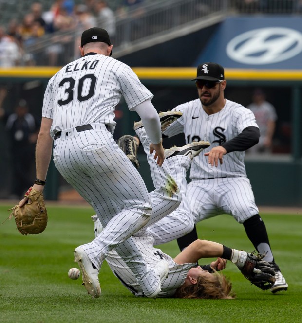 White Sox second baseman Chase Meidroth can't catch a fly ball next to first baseman Tim Elko (30) and outfielder Mike Tauchman as Tigers second baseman Colt Keith ties the game with an RBI single in the seventh inning on June 5, 2025, at Rate Field. (Brian Cassella/Chicago Tribune)