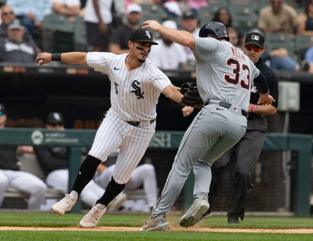 White Sox third baseman Josh Rojas tags out Tigers second baseman Colt Keith in a rundown after his RBI single tied the game in the seventh inning on June 5, 2025, at Rate Field. (Brian Cassella/Chicago Tribune)