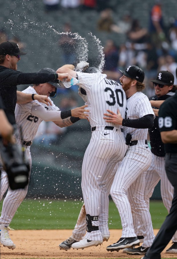 Chicago White Sox first baseman Tim Elko celebrates his game-winning hit with teammates in the tenth inning to defeat the Detroit Tigers on Thursday, June 5, 2025, at Rate Field. (Brian Cassella/Chicago Tribune)