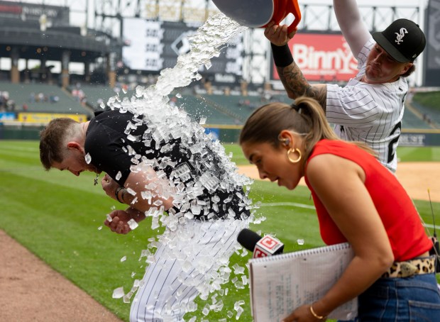 Chicago White Sox first baseman Tim Elko gets an ice bath from teammate Korey Lee to celebrate his game-winning hit with teammates to defeat the Detroit Tigers on Thursday, June 5, 2025, at Rate Field. (Brian Cassella/Chicago Tribune)