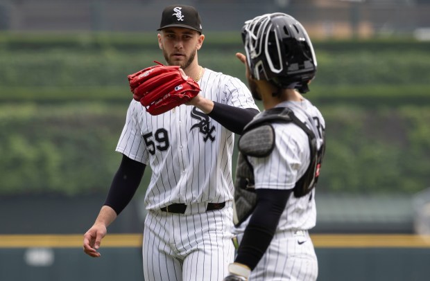 Chicago White Sox pitcher Sean Burke celebrates with catcher Edgar Quero between innings against the Detroit Tigers in the third inning Thursday, June 5, 2025, at Rate Field. (Brian Cassella/Chicago Tribune)
