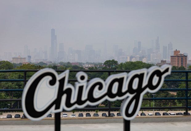 Wildfire haze clouds out the Chicago skyline on June 5, 2025, from Rate Field. (Brian Cassella/Chicago Tribune)
