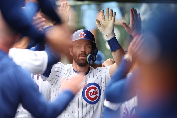 Cubs shortstop Dansby Swanson celebrates in the dugout after hitting a solo home run in the sixth inning against the Pirates on Saturday, June 14, 2025, at Wrigley Field. (Geoff Stellfox/Getty Images)