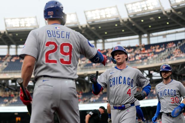 Cubs center fielder Pete Crow-Armstrong (4) celebrates his home run with Michael Busch (29) and Kyle Tucker during the first inning against the Nationals on June 5, 2025, in Washington. (Jess Rapfogel/AP)