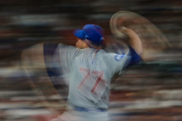 Chicago Cubs relief pitcher Chris Flexen throws during the sixth inning of a baseball game against the Houston Astros in Houston, Friday, June 27, 2025. (AP Photo/Ashley Landis)