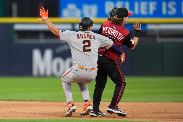 San Francisco Giants' Willy Adames (2), left, runs into Chicago White Sox shortstop Chase Meidroth (10) during the fifth inning of a baseball game Friday, June 27, 2025, in Chicago. (AP Photo/Erin Hooley)