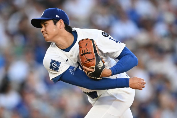 Los Angeles Dodgers starting pitcher Shohei Ohtani throws to a San Diego Padres batter during the first inning of a baseball game Monday, June 16, 2025, in Los Angeles. (AP Photo/Kyusung Gong)