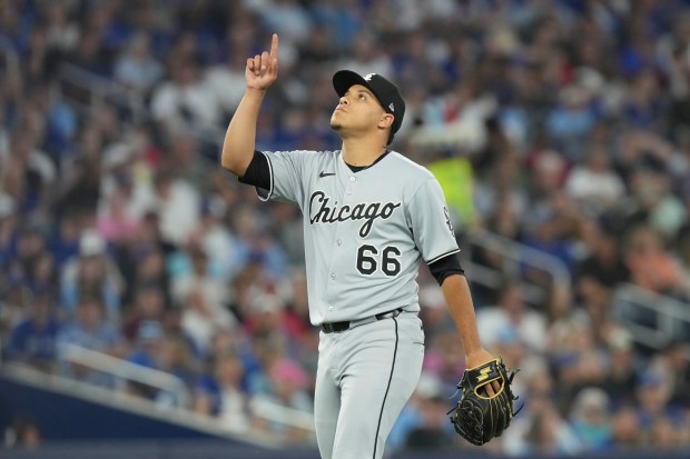 Chicago White Sox pitcher Wikelman Gonzalez reacts as he walks back to the dugout after making his debut during seventh-inning baseball game action against the Toronto Blue Jays in Toronto, Friday June 20, 2025. (Chris Young/The Canadian Press via AP)