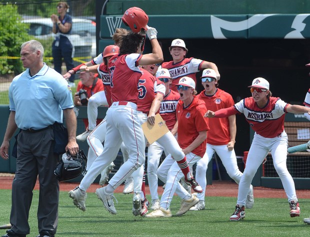 Neshaminy players celebrate as (7) Anthony Kurley scored to make it 3-1 in the sixth inning Thursday at Villanova stadium in Plymouth, . PETE BANNAN-MEDIANEWS GROUP