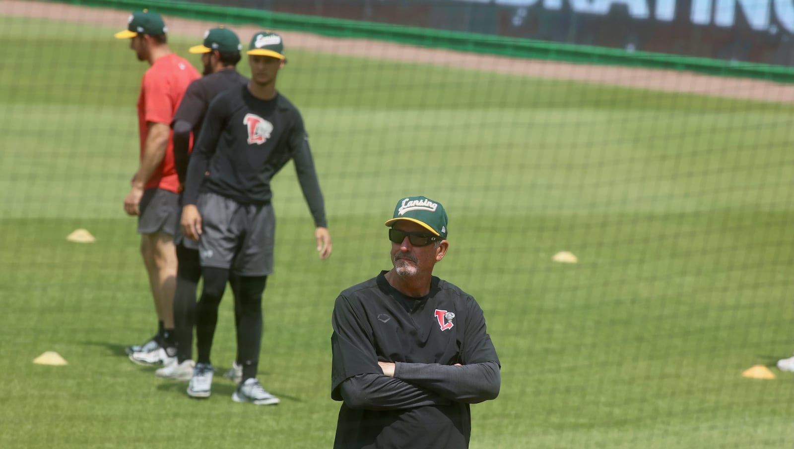 Former big-league pitcher Dave Burba, a graduate of Kenton Ridge High School, watches a pitcher warm up before a game at Day Air Ballpark in Dayton on Tuesday, June 3, 2025. Burba is the pitching coach for the Lansing Lugnuts. David Jablonski/Staff