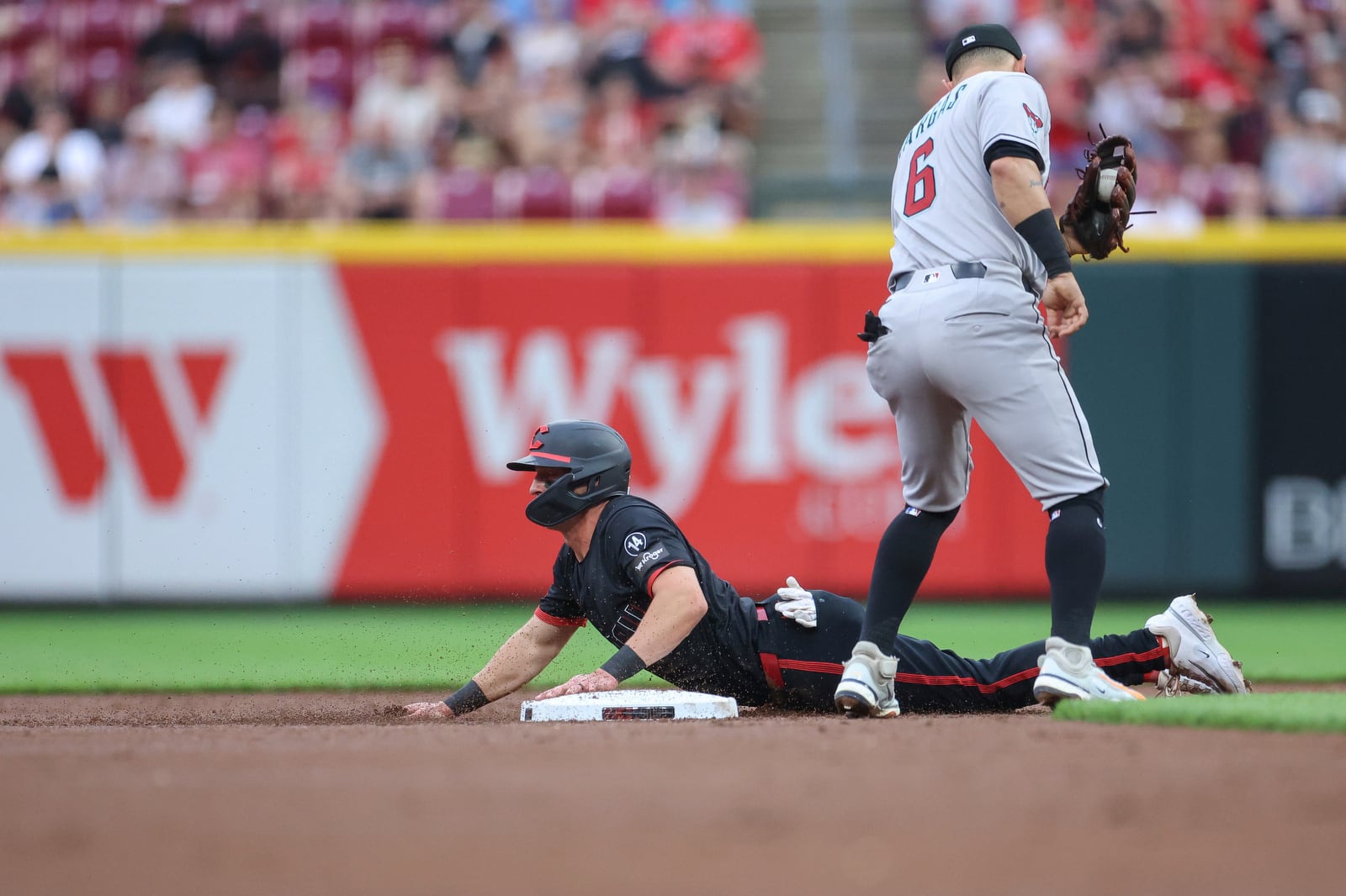 Cincinnati Reds' Spencer Steer slides into second base after advancing on a balk during the second inning of a baseball game against the Arizona Diamondbacks, Friday, June 6, 2025, in Cincinnati. (AP Photo/Abdoul Sow)