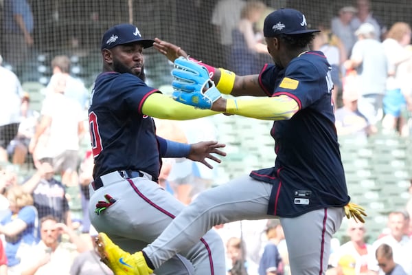 Braves designated hitter Marcell Ozuna (left) celebrates Wednesday's win with Ronald Acuña Jr.