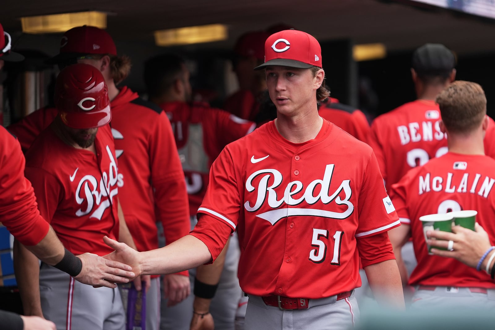 Cincinnati Reds pitcher Brady Singer (51) reacts with teammates after the sixth inning against the Detroit Tigers during a baseball game, Saturday, June 14, 2025, in Detroit. (AP Photo/Paul Sancya)