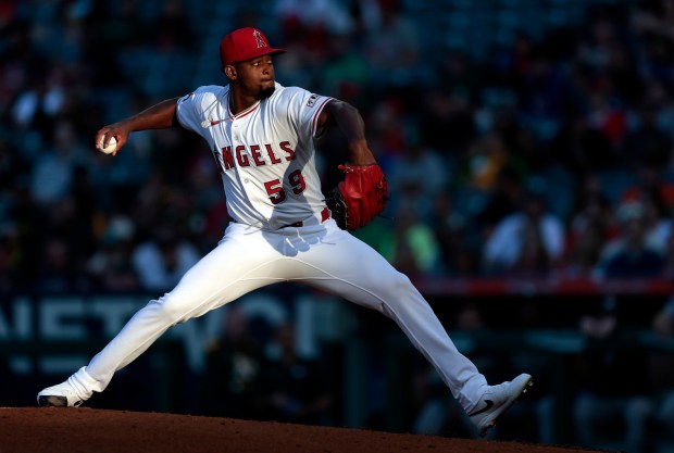 Angels starting pitcher José Soriano throws to the plate during the third inning of their game against the Athletics on Tuesday night at Angel Stadium. Soriano struck out a career-high 12 and allowed one run in seven innings, as the Angels went on to win, 2-1, in 10 innings. (Photo by Ronald Martinez/Getty Images)