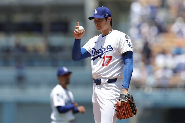 Los Angeles Dodgers starting pitcher Shohei Ohtani gestures before a baseball game against the Washington Nationals in Los Angeles, Sunday, June 22, 2025. (AP Photo/Jessie Alcheh)
