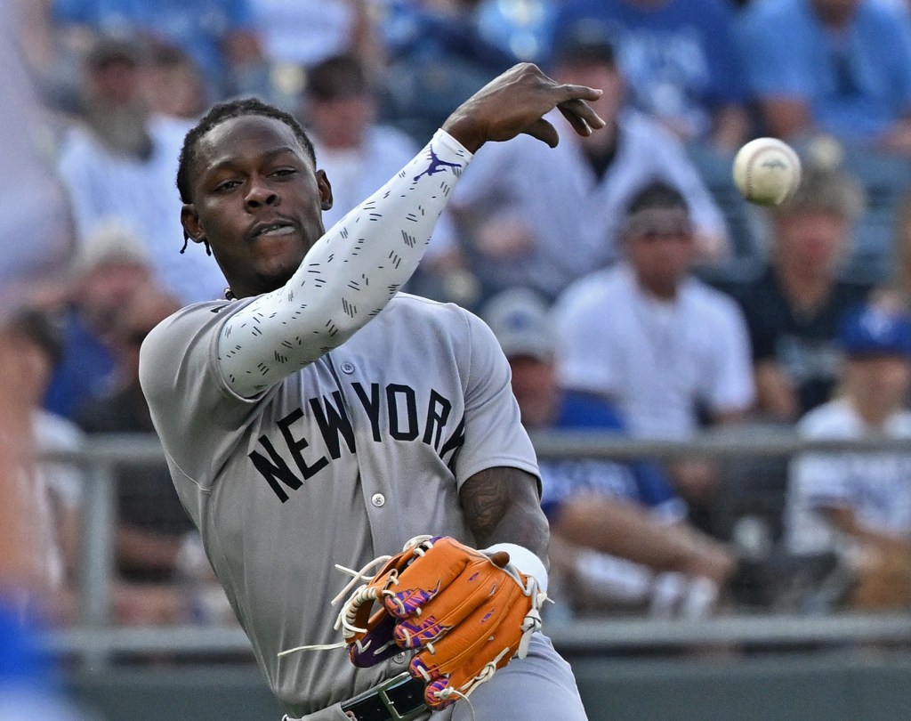 Jazz Chisholm, who exited early with neck tightness, throws to first base during the second inning of the Yankees' 10-2 blowout win over the Royals on June 10, 2025.