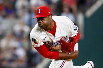 Texas Rangers starting pitcher Kumar Rocker (80) throws a pitch during the second inning of...